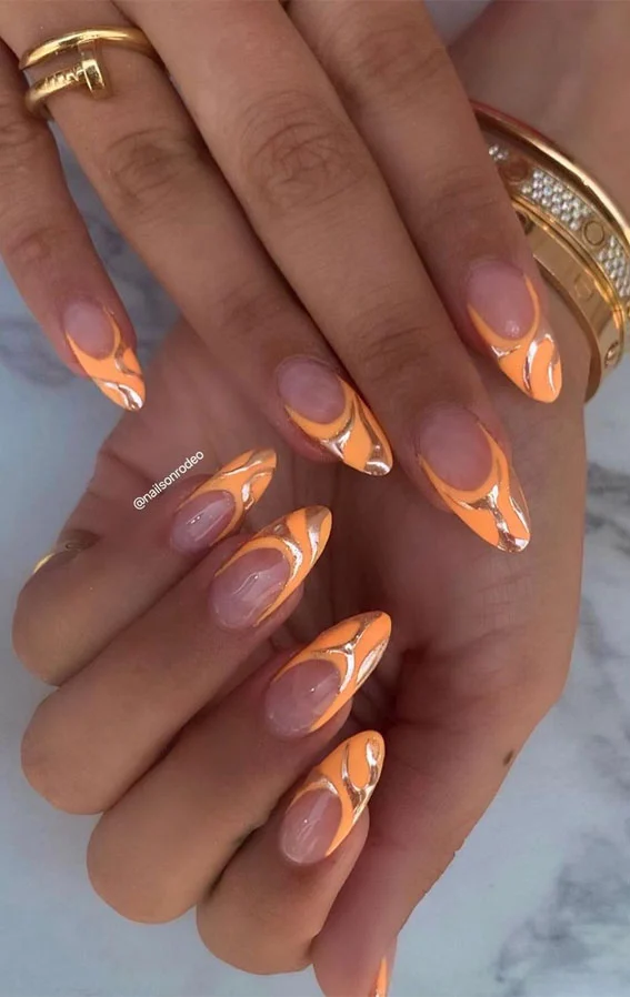 Acrylic Nail Designs for Every Skin Tone: Light, Medium, Tan & Dark 13 Burnt orange chrome-tipped acrylic nails on tan skin, styled in a French design.
