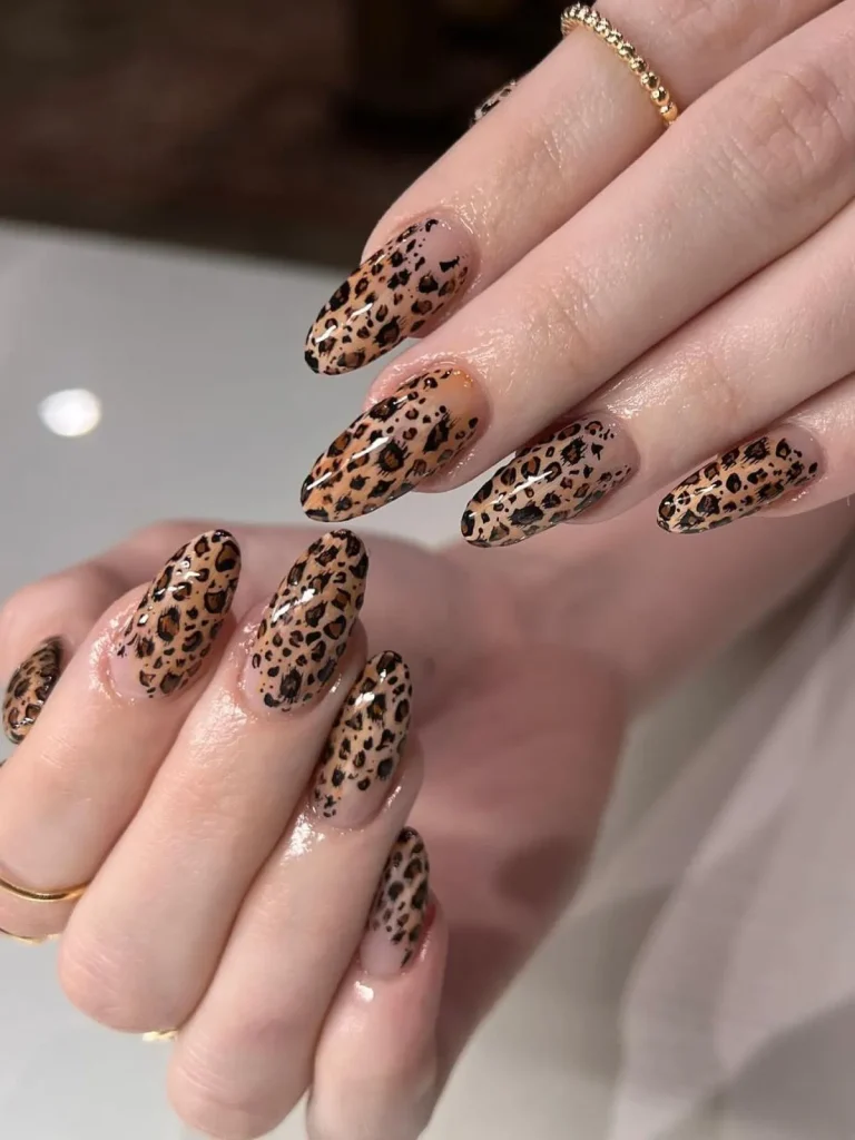 27 Cheetah Nail Designs That Will Bring Out Your Wild Side 11 Classic Almond Nude Nails with Black Cheetah Pattern
Timeless nude almond nails featuring a clean, sharp black cheetah print — elegant and wild.