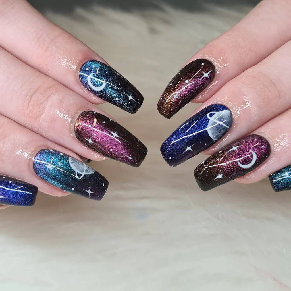 galaxy-inspired blue aura nails with shimmer