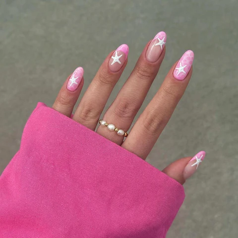 50+ Cute Pink Nail Ideas You’ll Want to Try in 2025 (Trendy, Girly & Pinterest-Perfect) 11 Pink star almond nails design on long nails