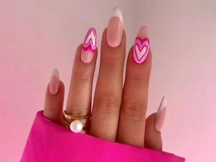 50+ Cute Pink Nail Ideas You’ll Want to Try in 2025 (Trendy, Girly & Pinterest-Perfect) 16 Valentine pink almond nails with heart French tips