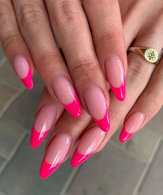 Bright stiletto nails with hot pink French tip design