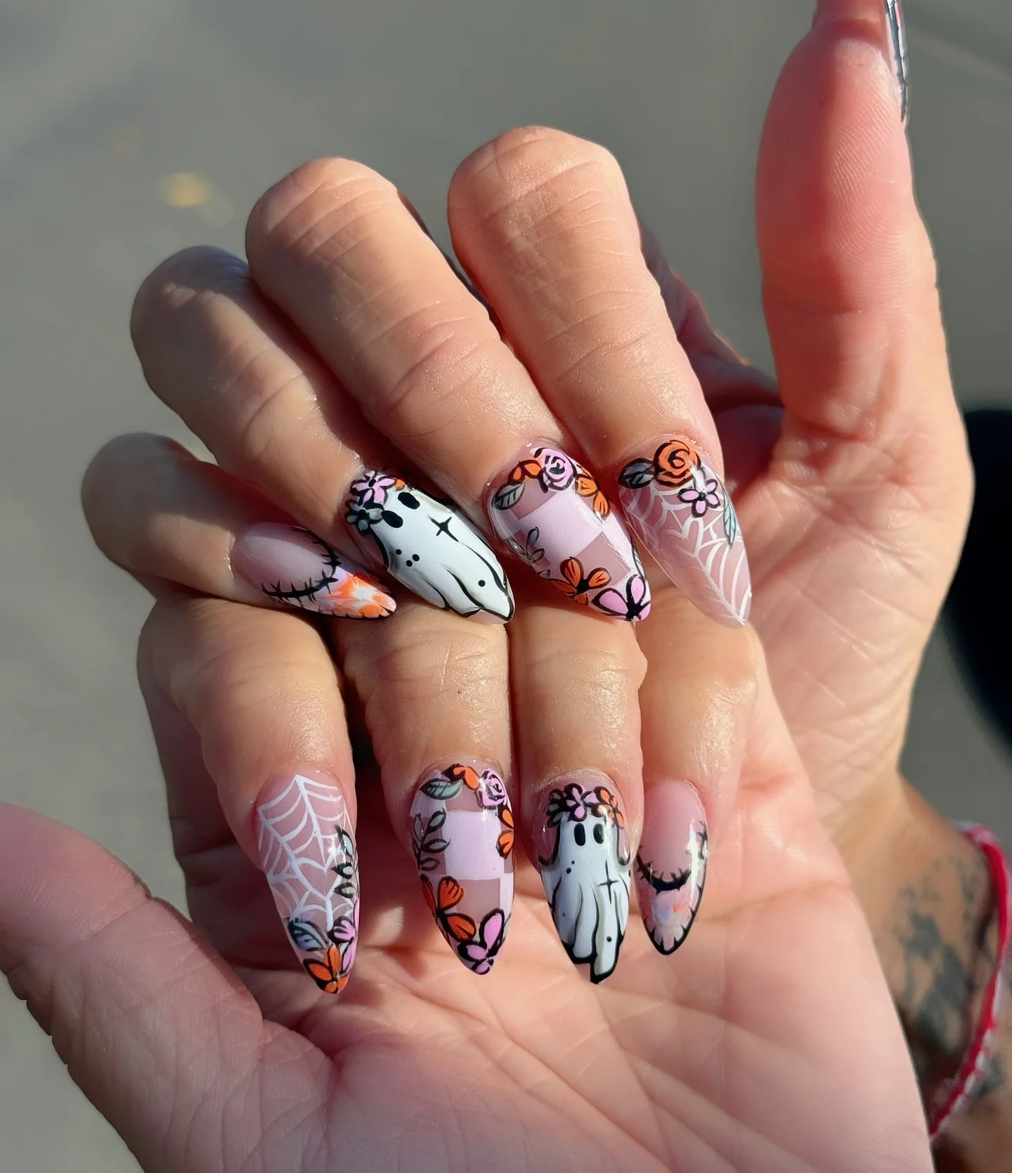 ghost floral Halloween nails pink orange — fall halloween nail design cute 2026