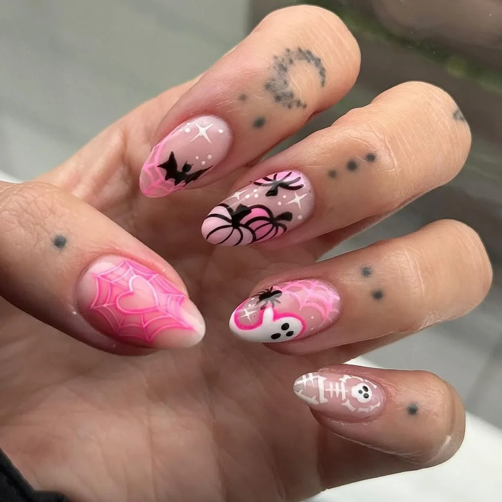 cute pink spider skeleton Halloween nails — sweet halloween nail art 2026