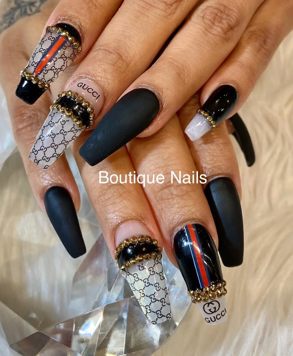 31 Nail Charm Ideas That Will Instantly Upgrade Your Nails in 2025 7 Black matte nails with Gucci logo charms