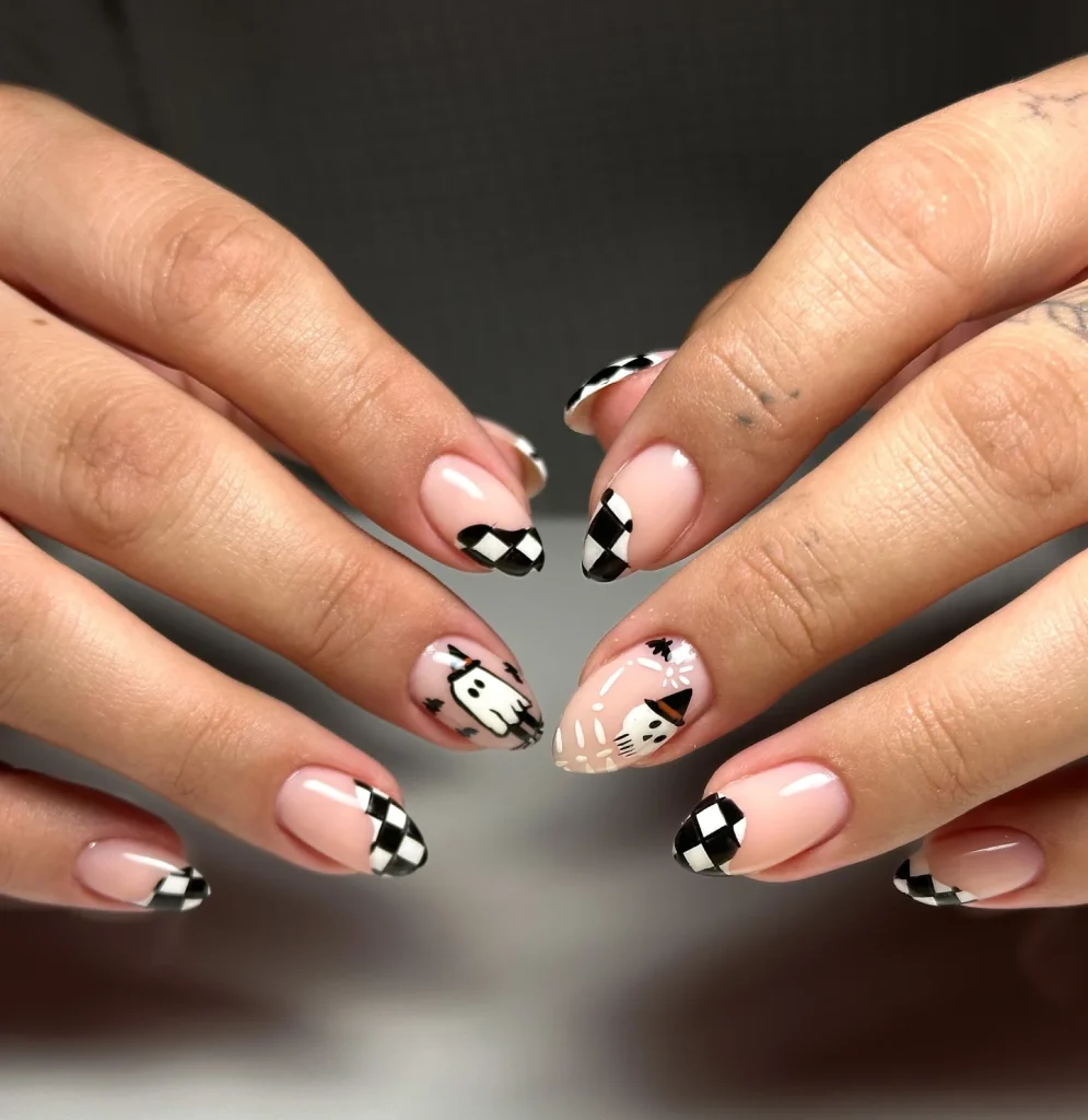 checkered ghost French tip Halloween nails black white — modern halloween manicure 2026