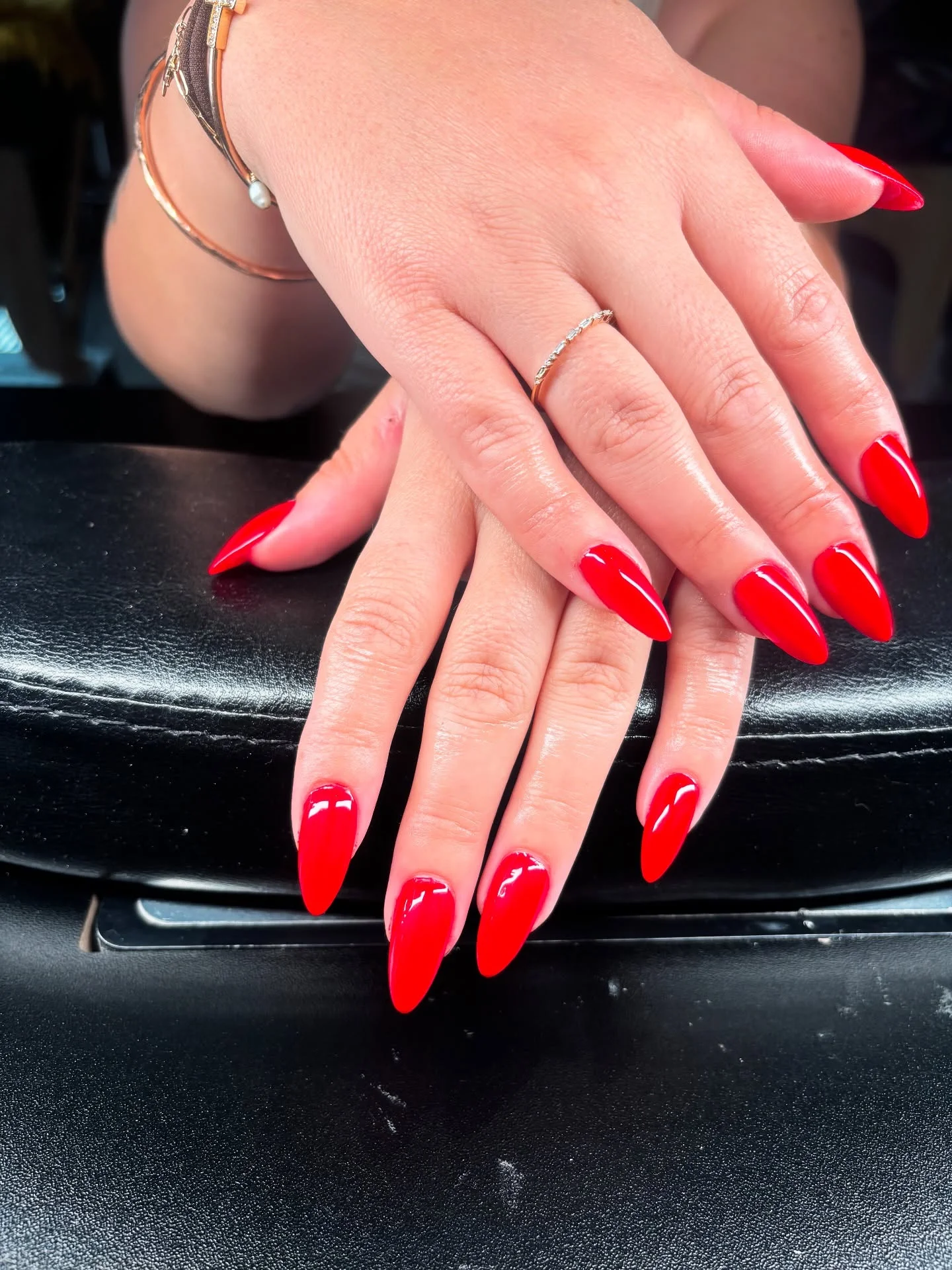 long glossy red almond nails closeup