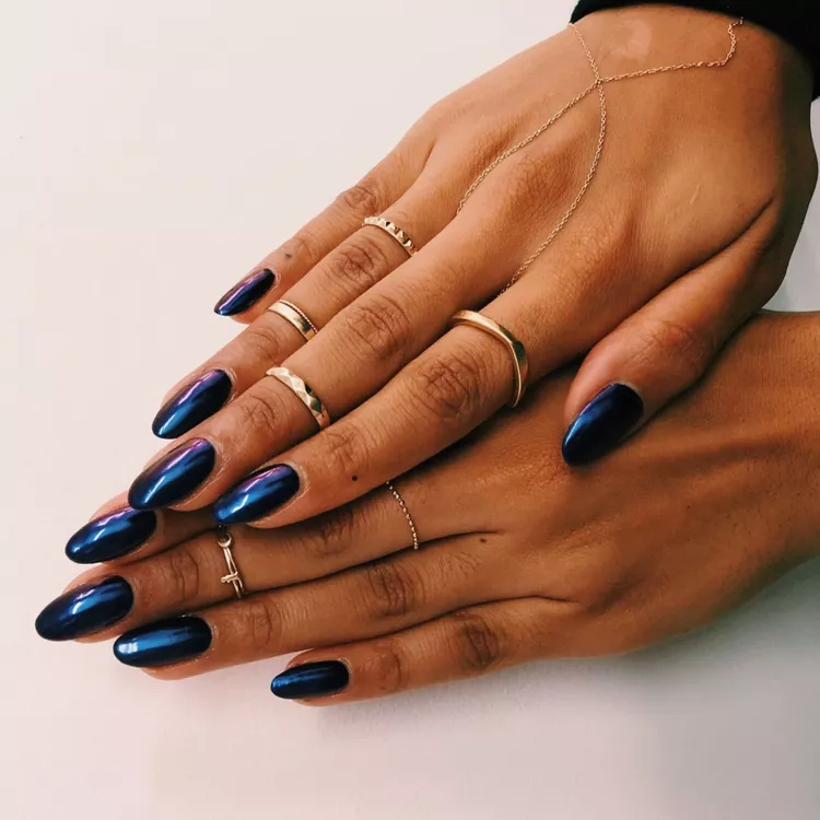 39 Navy Blue Nail Ideas That Are Too Gorgeous Not to Try in 2026 7 Almond nails with navy base and mirror chrome finish. Bright studio lighting to show the reflective, mirror-like quality clearly.