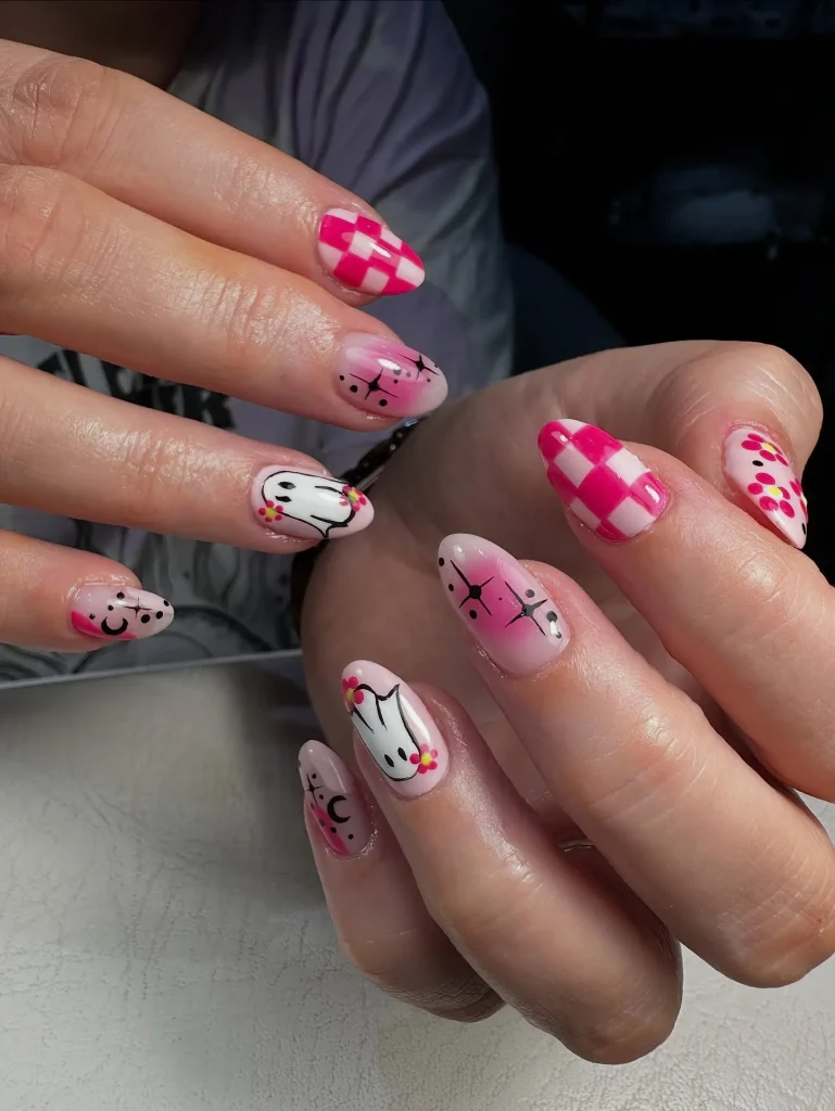 pink ghost checkered floral Halloween nails — maximalist halloween nail art 2026