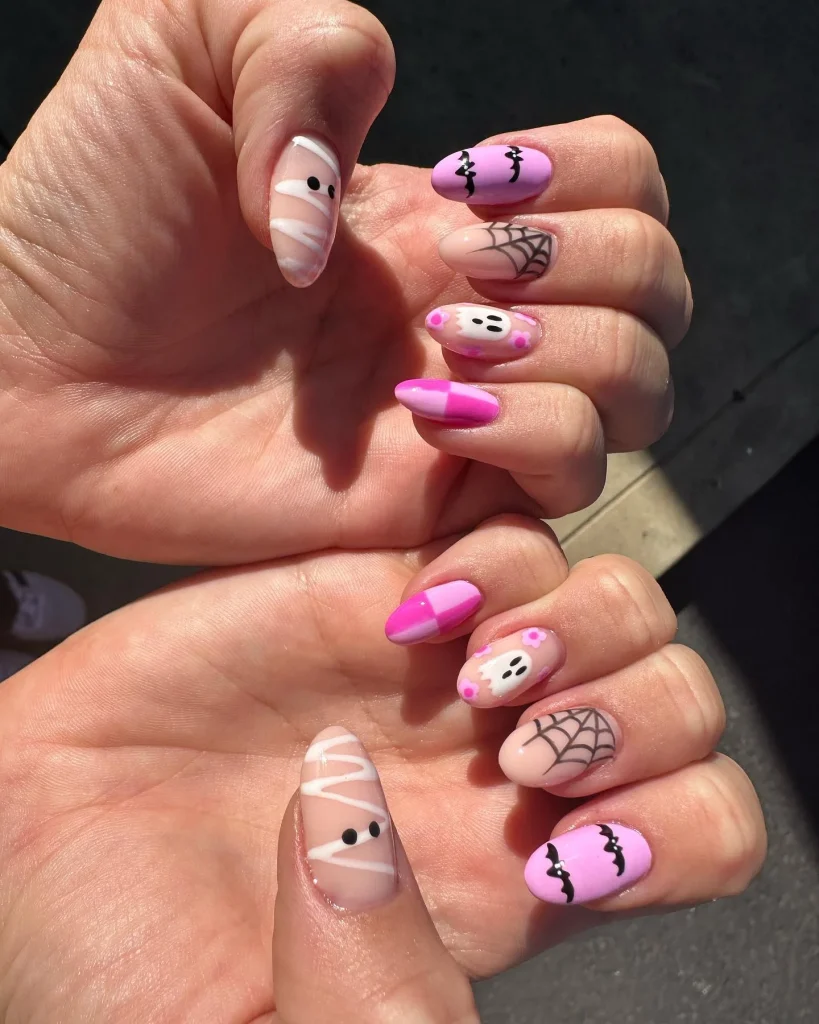 pink mummy ghost Halloween nail art — adorable pink halloween nails 2026