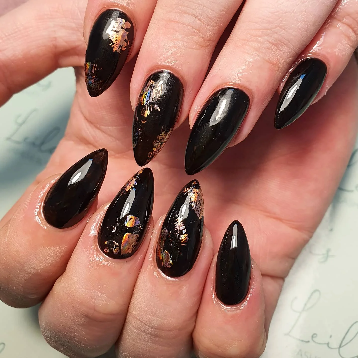 shiny black almond nails with foil