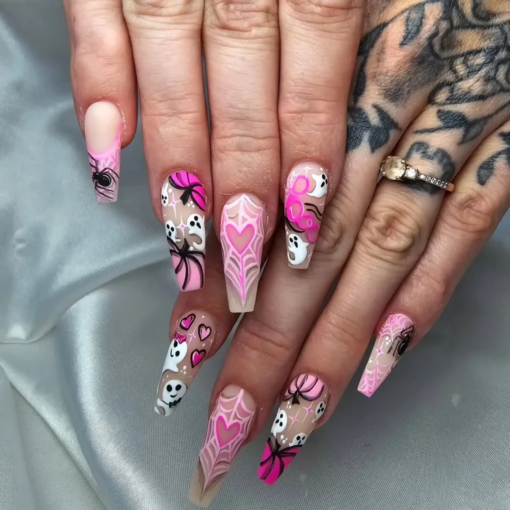 spooky pink Halloween nails with spiderwebs — wearable halloween nail design 2026