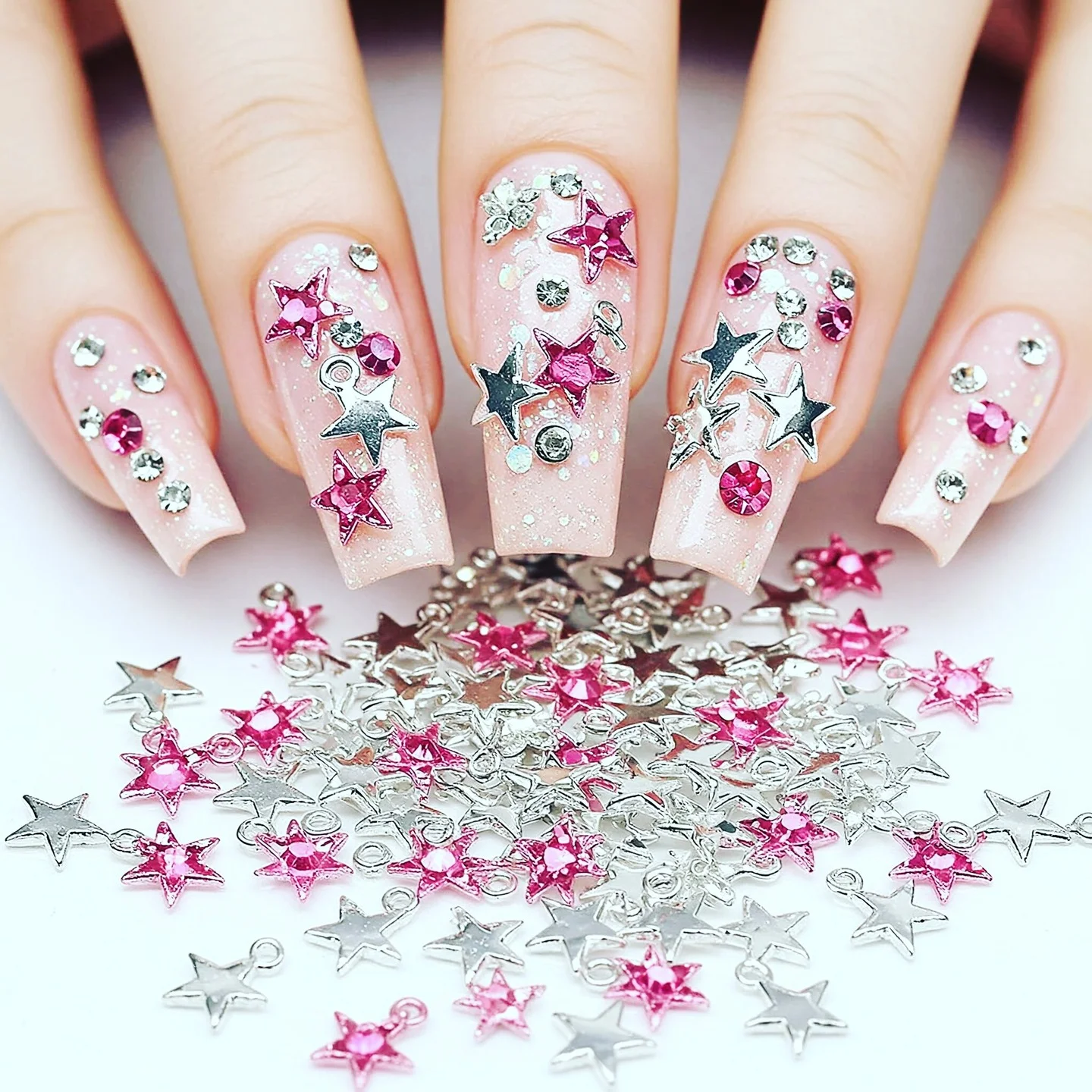 31 Nail Charm Ideas That Will Instantly Upgrade Your Nails in 2025 22 Star nail charms with rhinestones and glitter accents