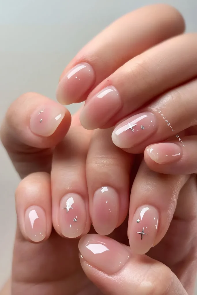 25+ Korean Winter Nail Ideas That Will Rule 2025 ❄️💅 20 Gradient pink blush nails with silver dots.