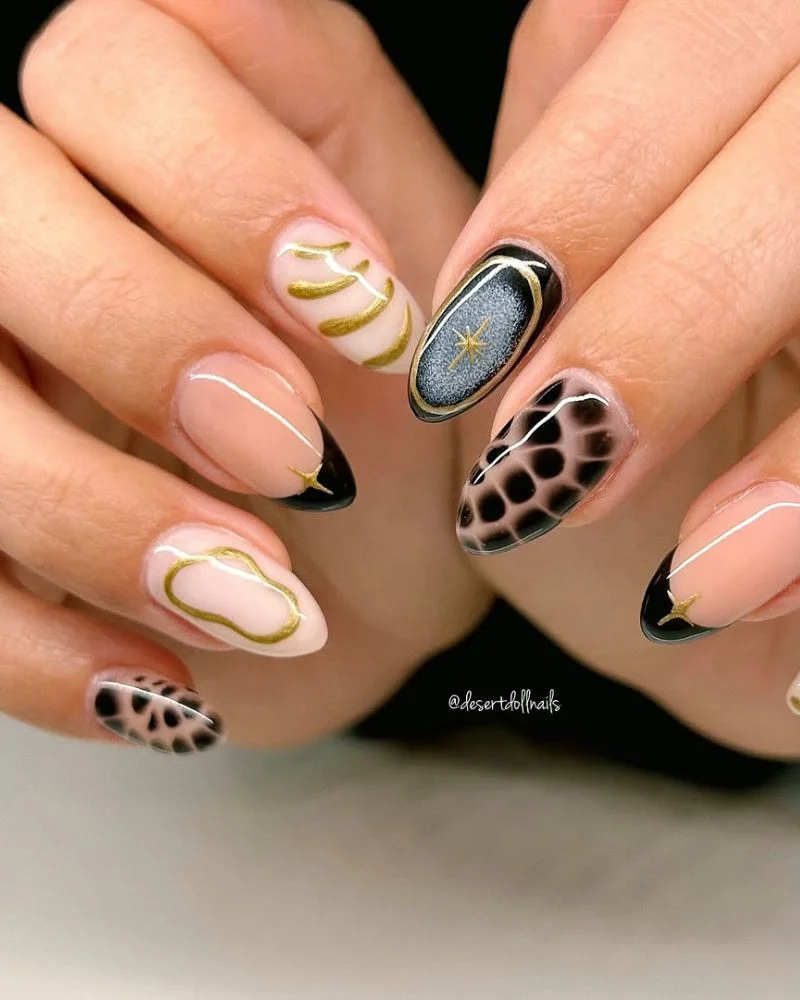 Black and White Nail Designs 2025: Chic Ideas for Every Occasion 17 Trendy almond-shaped nails with a mix of black and nude designs, featuring gold accents, abstract patterns, and silver chrome effects for a bold, artistic manicure.