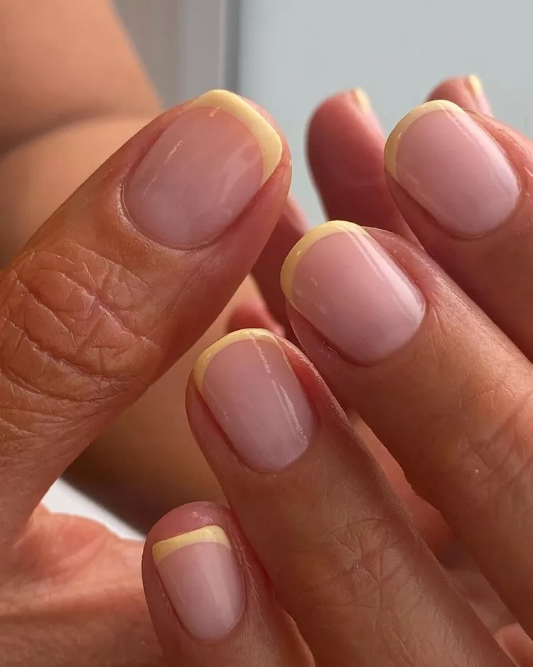 20 Beautiful Butter Yellow Nails Design You’ll Love This Summer 8 Short modern pastel yellow French tip square oval nails