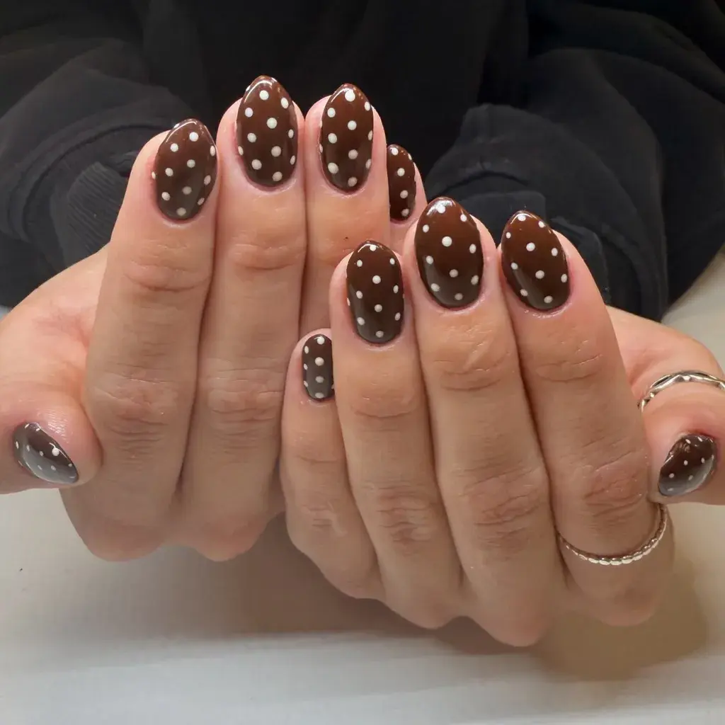 "Brown Polka Dot Nails," "Vintage Nail Art," "Oval Shape Manicure," "Classic Polka Dot"