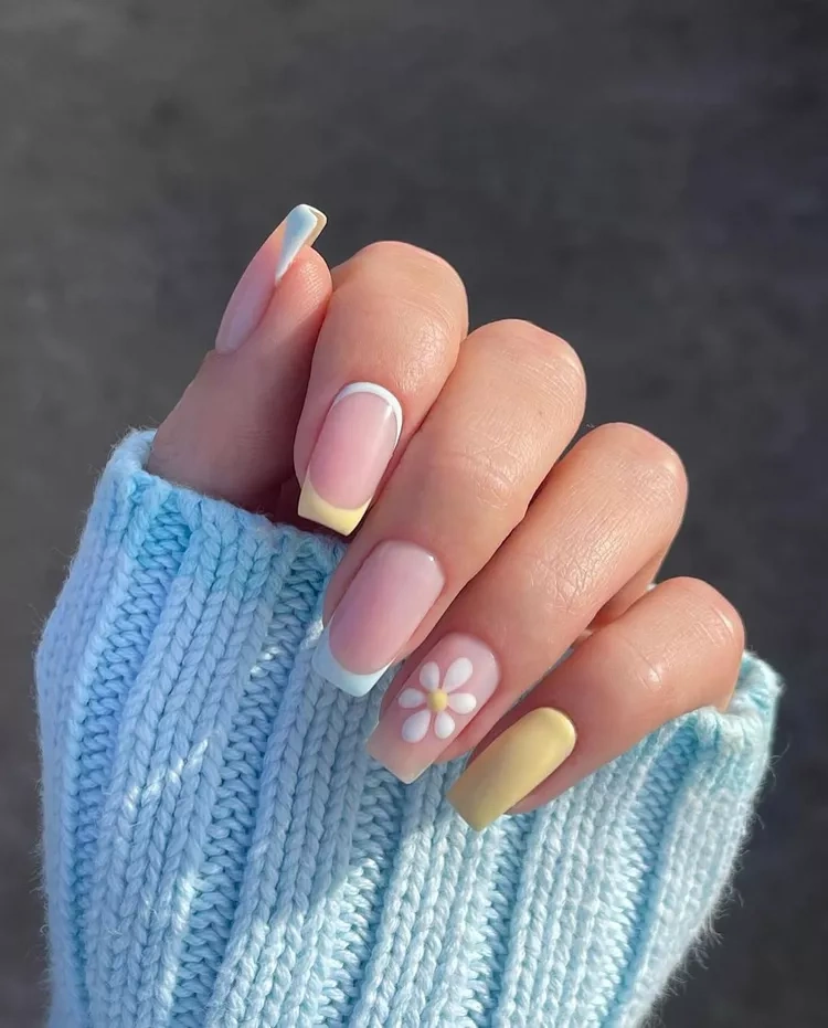 20 Beautiful Butter Yellow Nails Design You’ll Love This Summer 12 Pastel yellow and blue French manicure coffin nails with daisy flower accent