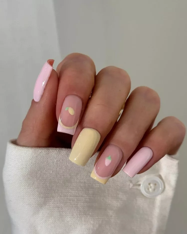 20 Beautiful Butter Yellow Nails Design You’ll Love This Summer 13 Long pastel pink and yellow French tip coffin nails with tiny fruit art
