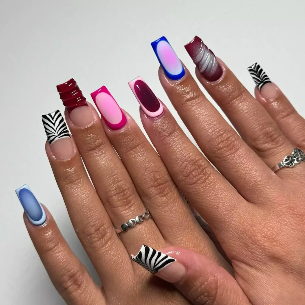 29 Simple Square Nail Designs for a Chic Summer Look (2025 Edition) 21 Eclectic maximalist nail art featuring zebra print, abstract, and ombré designs