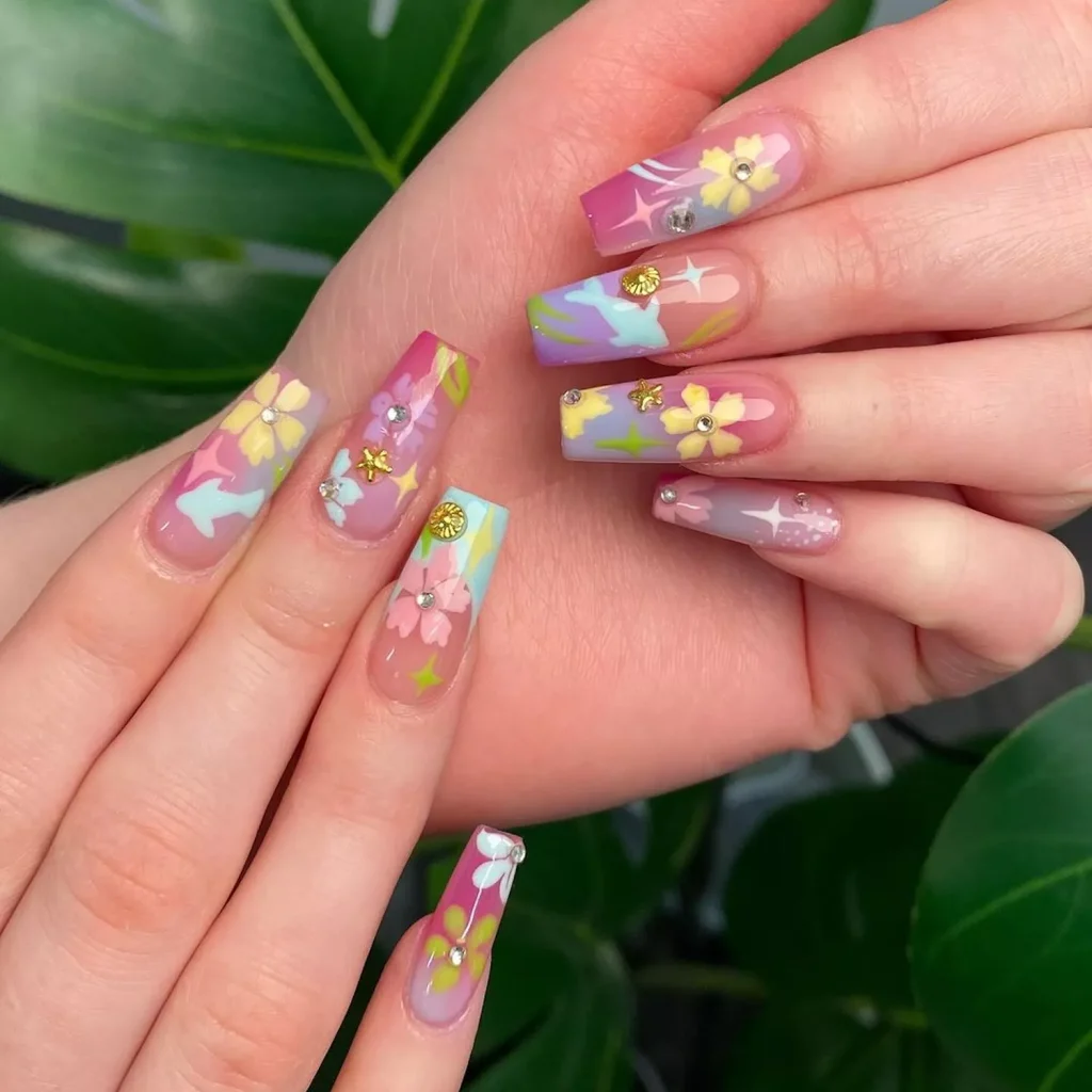29 Simple Square Nail Designs for a Chic Summer Look (2025 Edition) 12 Long coffin nails with pastel floral nail art, gold studs, and spring flower decals