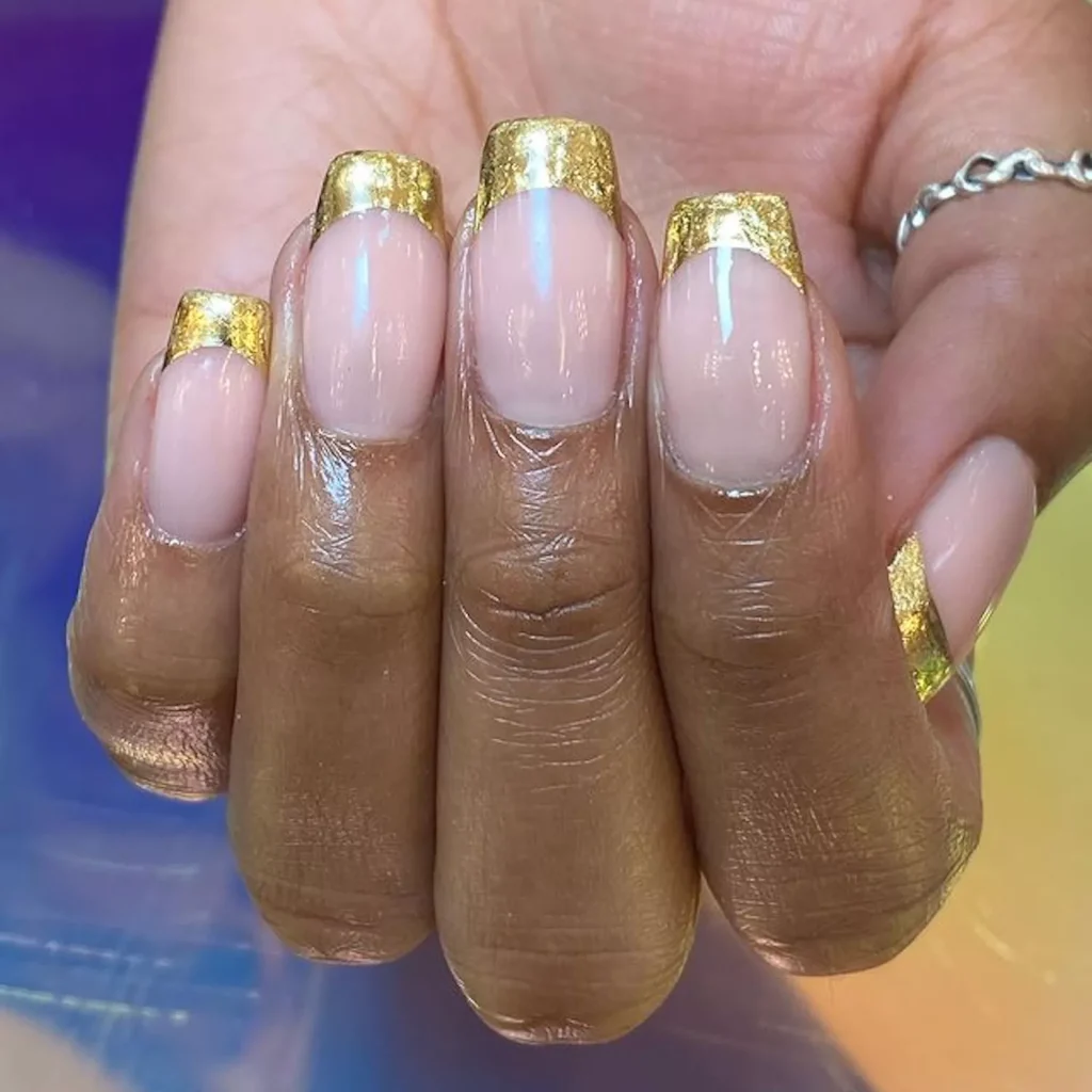 29 Simple Square Nail Designs for a Chic Summer Look (2025 Edition) 9 Metallic gold French tips on short square nails with a shiny nude base coat