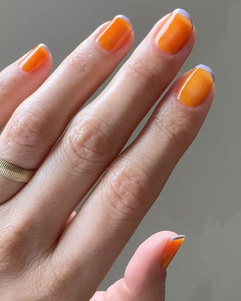 29 Simple Square Nail Designs for a Chic Summer Look (2025 Edition) 18 Shiny orange jelly nails with a subtle grey micro-French tip on short rounded nails