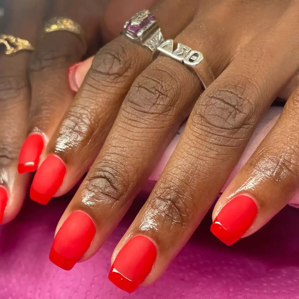 29 Simple Square Nail Designs for a Chic Summer Look (2025 Edition) 26 Close-up of a deep red matte French manicure on short square nails