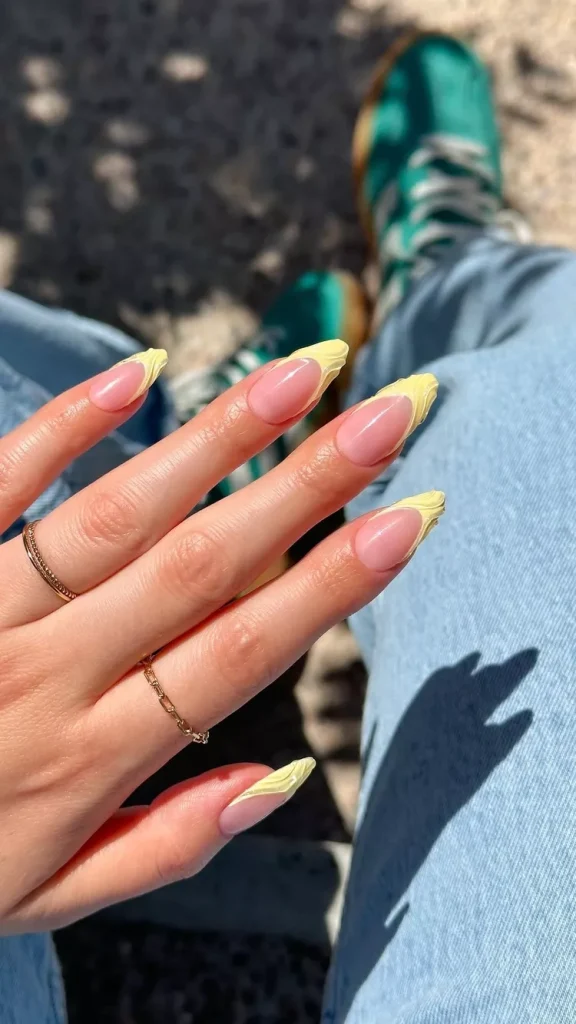 20 Beautiful Butter Yellow Nails Design You’ll Love This Summer 4 3D pastel butter yellow wavy French tip coffin nails"