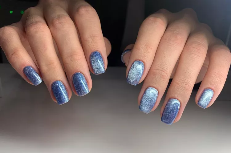 30 Stunning Dark Blue Nail Designs for a Denim-Inspired Summer Look 19 Shimmering light blue magnetic cat-eye nails on short square nails. A gorgeous holographic and reflective polish for a dimensional glitter manicure look.