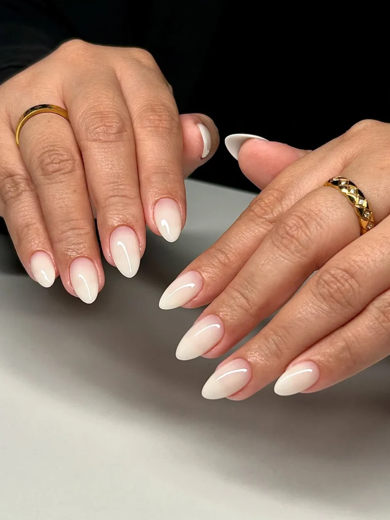 7 Nail Colors That Make Hands Look Younger After 60 (2026 Guide) 6 milky white nail color for mature women — clean elegant manicure 2026