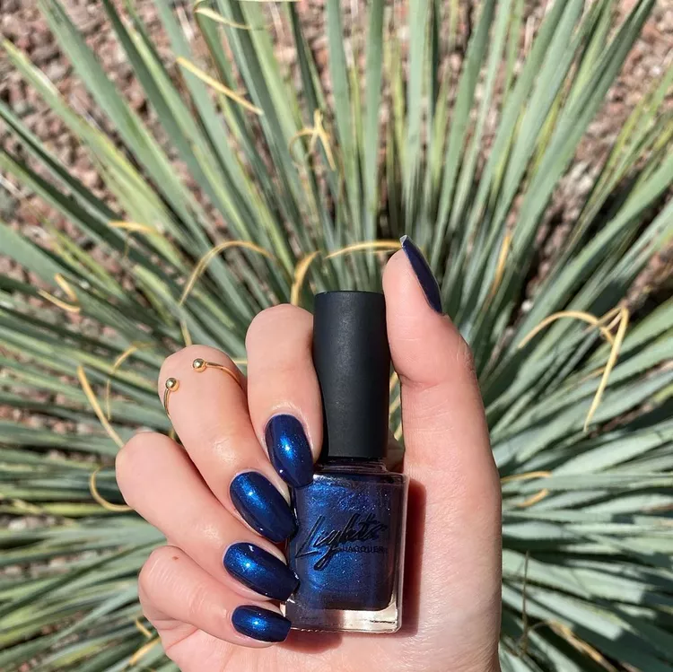 30 Stunning Dark Blue Nail Designs for a Denim-Inspired Summer Look 22 Dark navy blue nail polish with a subtle metallic shimmer finish. A chic, rich winter nail color for short, rounded nails.