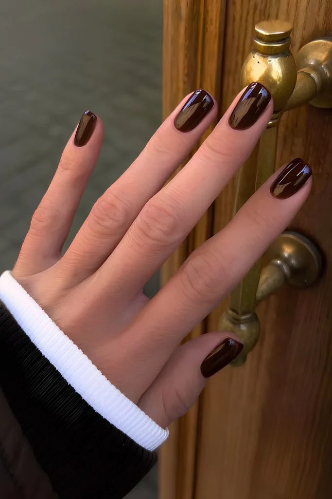 25 Back to School Nail Ideas 2026 Cute, Classy & School-Appropriate Designs for Students & Teachers 16 Short and glossy deep brown manicure.jpg