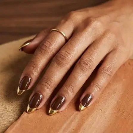 30 Chocolate Brown Nail Designs 2026 Rich, Cozy & Completely Irresistible — The Trendiest Color of the Year 14 brown gold glitter French tip nails 2026 — celebratory holiday luxurious manicure