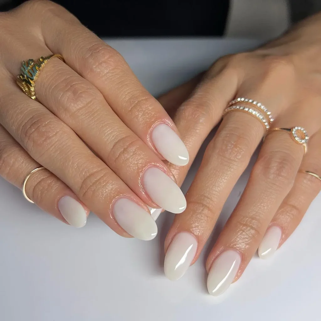 25 Back to School Nail Ideas 2026 Cute, Classy & School-Appropriate Designs for Students & Teachers 6 milky white short oval back to school nails 2026 — modern clean school manicure