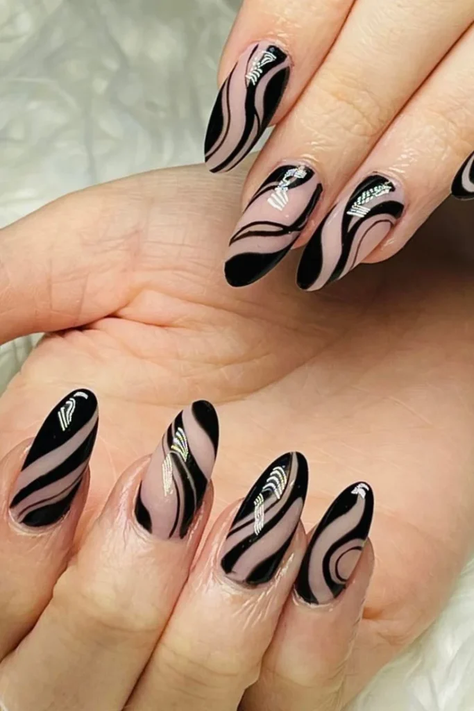 25 Stunning Almond Fall Nails Perfect for a Chic Autumn Vibe (2026) 18 almond fall nails 2026 dark swirl abstract nail art