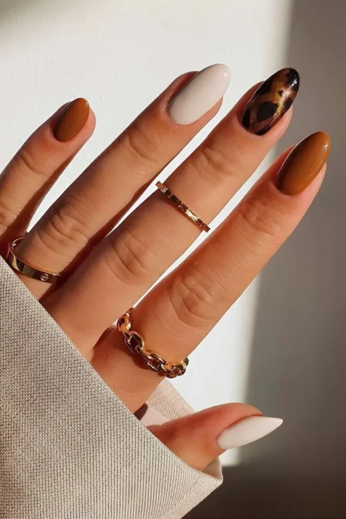 30 Trendy Short Fall Nails Perfect for a Classy Look 17 terracotta tortoiseshell accent short fall nails 2026 — mixed earthy manicure
