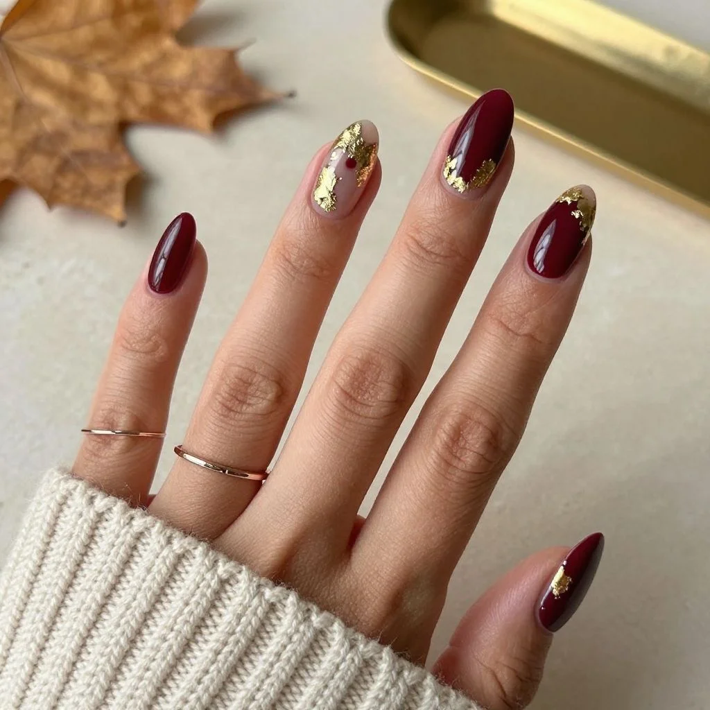 25 Stunning Almond Fall Nails Perfect for a Chic Autumn Vibe (2026) 20 almond fall nails 2026 gold leaf plum nail art