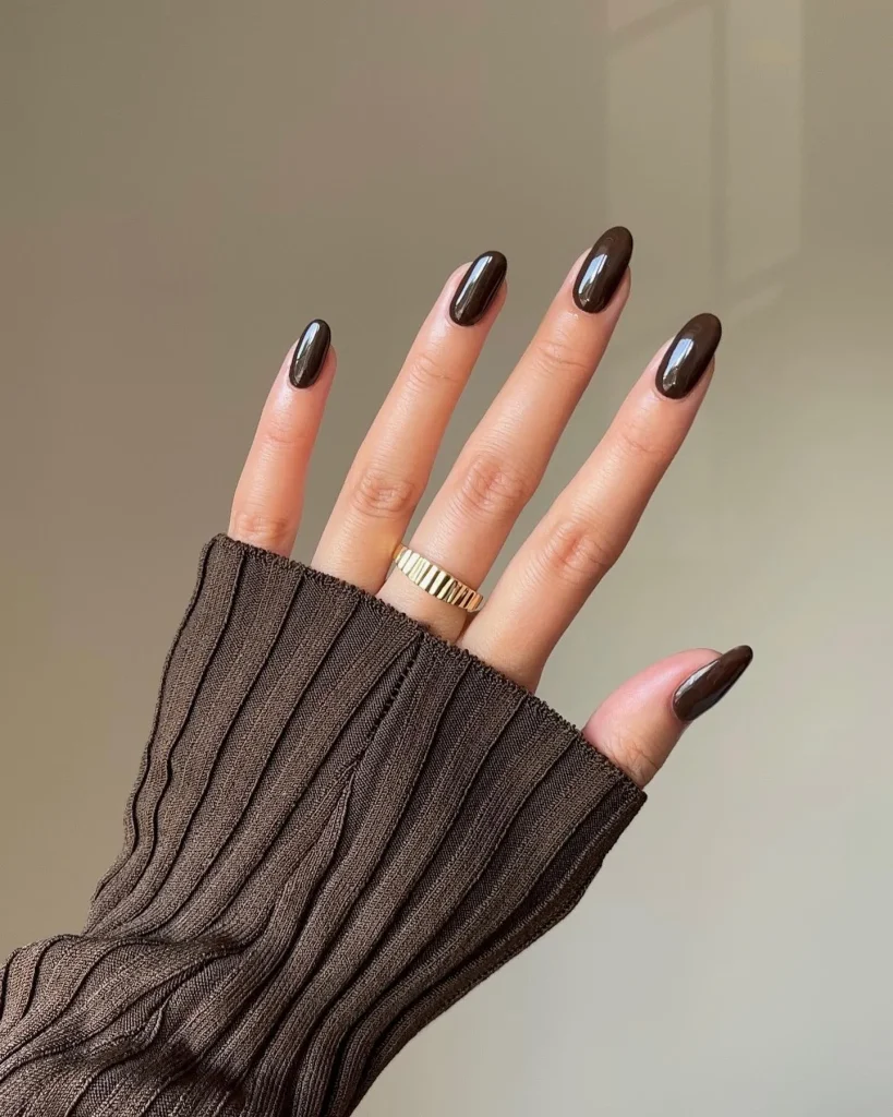 30 Trendy Short Fall Nails Perfect for a Classy Look 28 black espresso gloss short almond fall nails 2026 — near black warm dramatic manicure