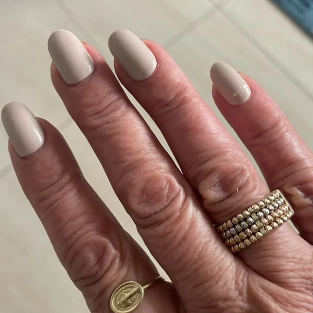 30 Trendy Short Fall Nails Perfect for a Classy Look 6 muted taupe oval matte short fall nails 2026 — restrained minimalist clean manicure